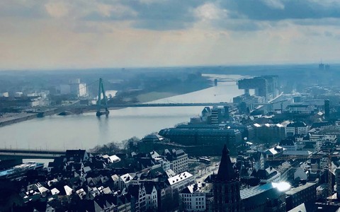 an_aerial_view_of_a_city_with_a_river_running_through_it - ©konrad_rolf