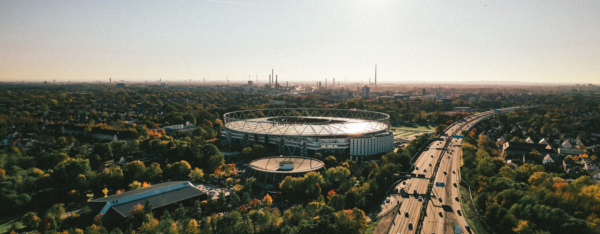 an_aerial_view_of_a_large_stadium_surrounded_by_trees - ©sebastianmark