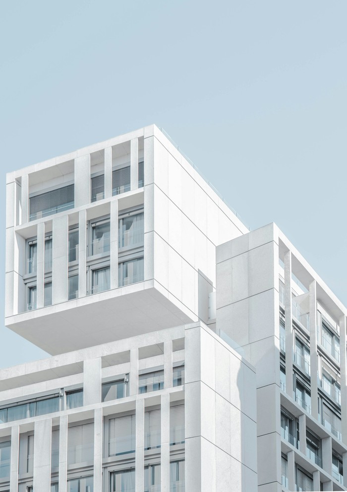 white_modern_cement_building_under_blue_sky - ©joelfilip
